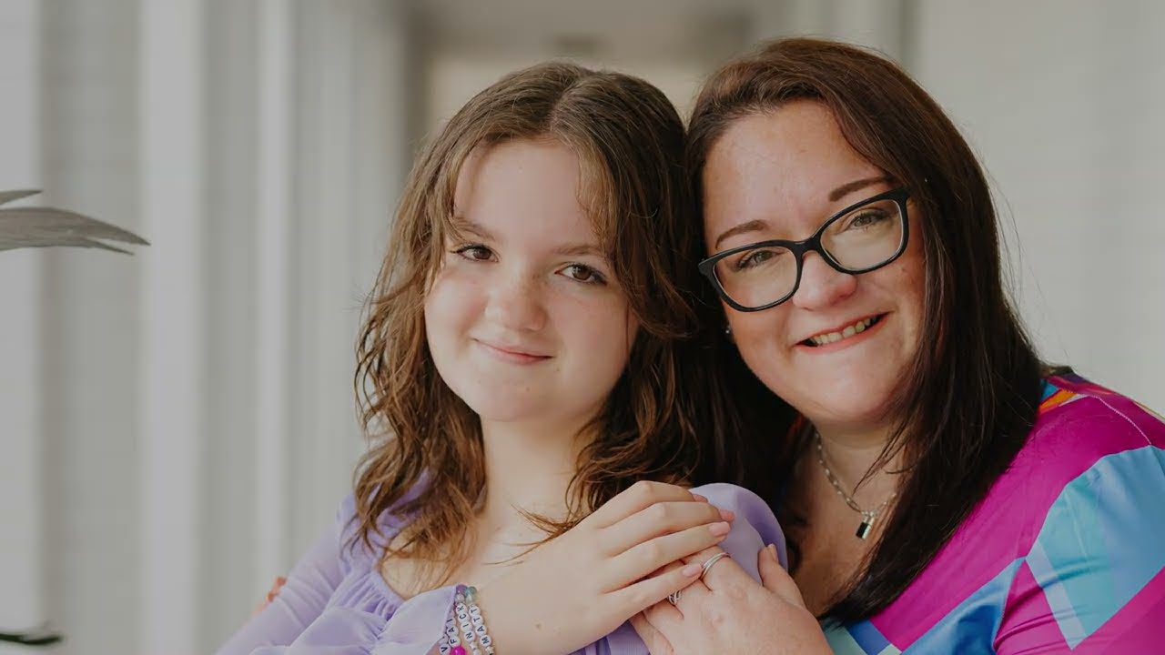 Mother and daughter smiling together for photo
