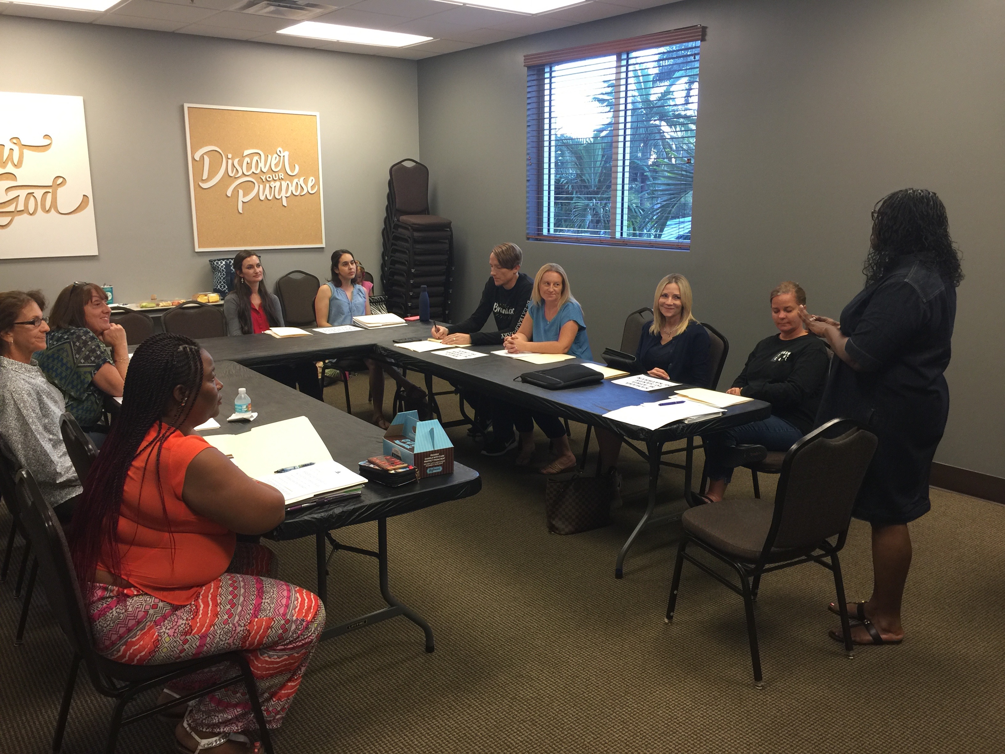 Teacher and adult students in a classroom