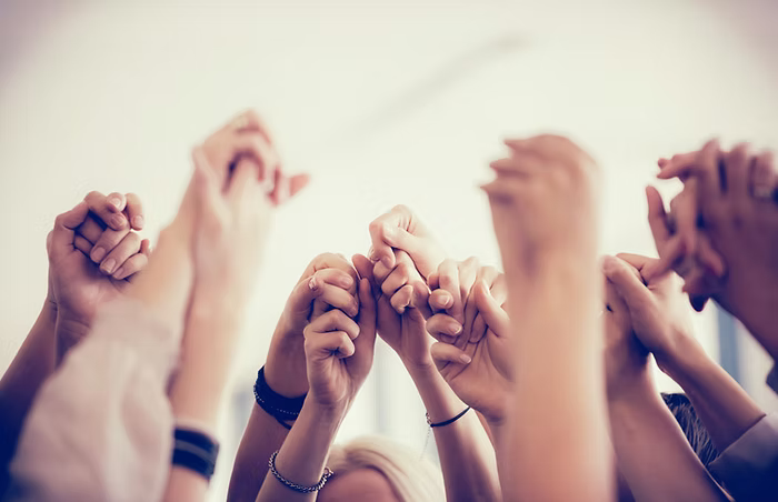 Staff, volunteers, and single moms gathered together, symbolizing community support and connection as Hearts For Moms prepares for a new Skills Development year.