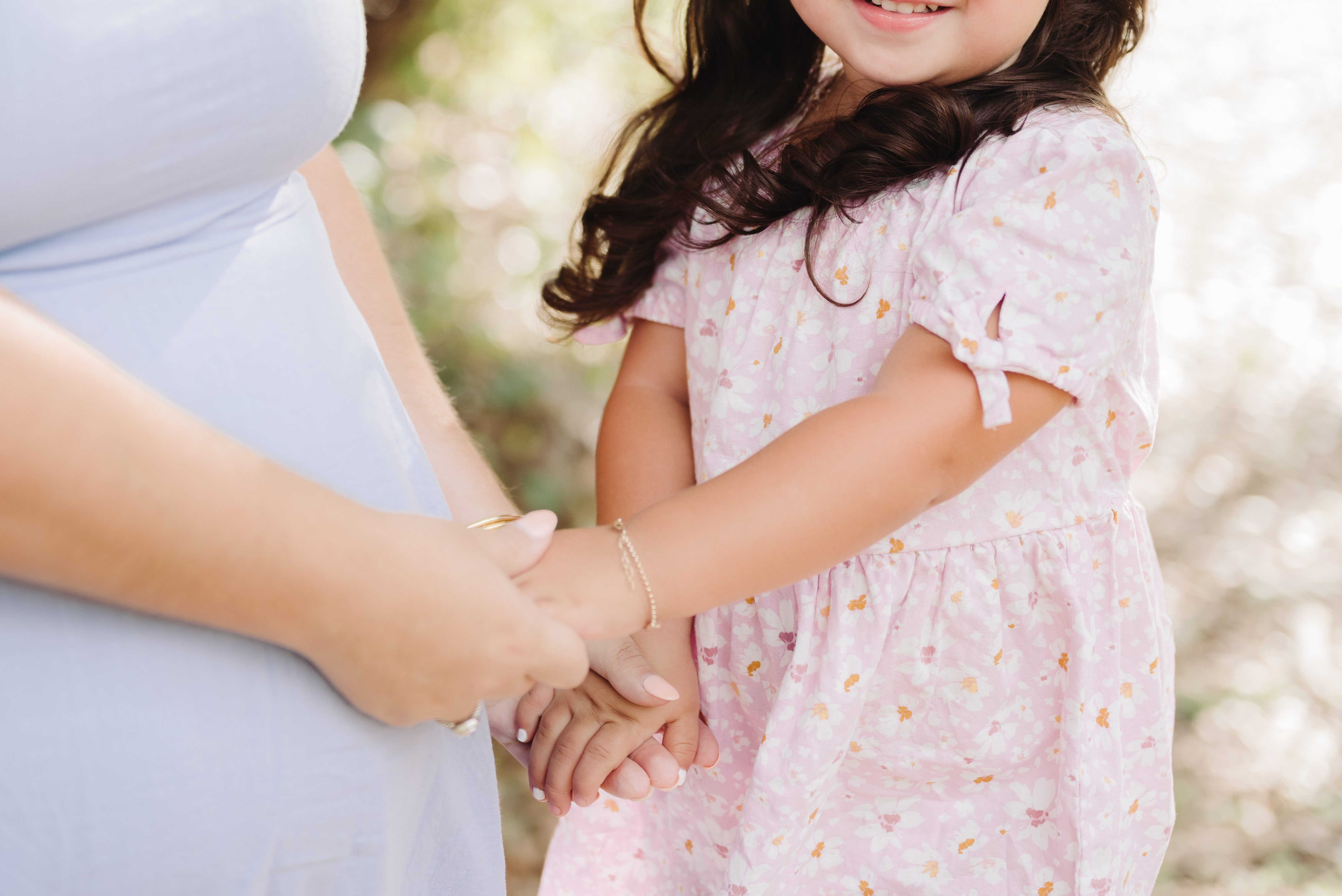 Child and Mom holding hands
